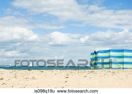 Stock Photograph - Windbreak on beach. Fotosearch