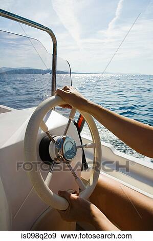 Woman driving a speed boat View Large Photo Image Stock Photo - Woman driving a speed boat. Fotosearch