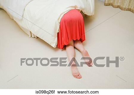 Woman under bed View Large Photo Image Stock Image - Woman under bed. Fotosearch