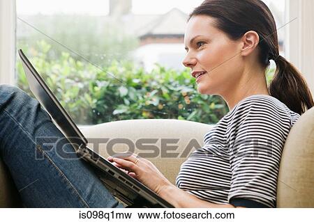 Woman with laptop View Large Photo Image Stock Photo - Woman with laptop. Fotosearch