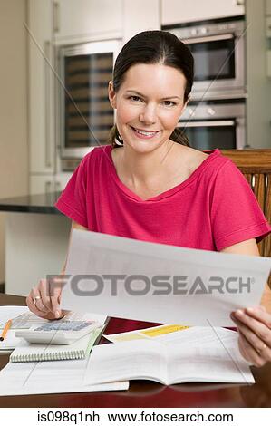 Woman with paperwork View Large Photo Image Stock Image - Woman with paperwork. Fotosearch
