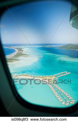 Airplane over society islands View Large Photo Image Stock Image - Airplane over society islands. Fotosearch