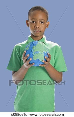 Stock Photograph - Boy with globe. Fotosearch
