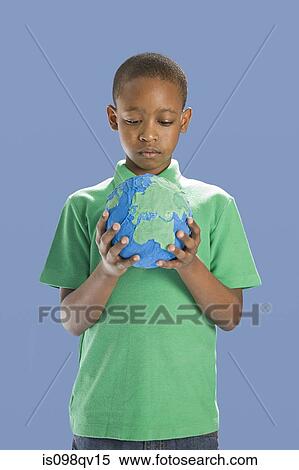 Boy with globe View Large Photo Image Stock Photography - Boy with globe. Fotosearch