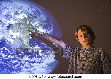 Boy with projection of earth View Large Photo Image Stock Image - Boy with projection of earth. Fotosearch