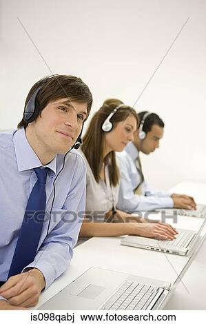Call centre workers View Large Photo Image Stock Image - Call centre workers. Fotosearch