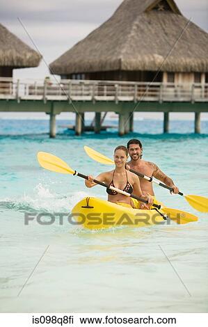 Couple in canoe in bora bora View Large Photo Image Stock Image - Couple in canoe in bora bora. Fotosearch