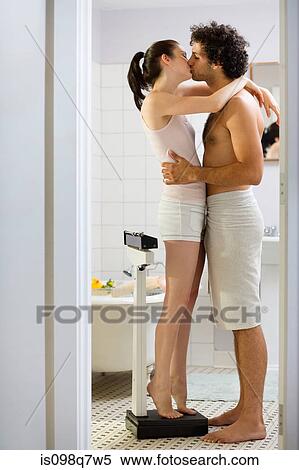 Couple kissing in the bathroom View Large Photo Image Stock Photography - Couple kissing in the bathroom. Fotosearch