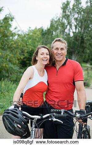 Couple of mature mountain bikers View Large Photo Image Stock Image - Couple of mature mountain bikers. Fotosearch