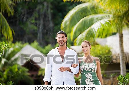 Stock Image - Couple on vacation in bora bora. Fotosearch