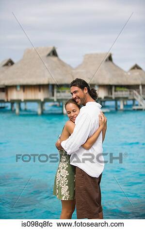 Stock Image - Couple on vacation in bora bora. Fotosearch