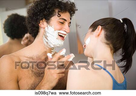 Stock Image - Couple playing with shaving foam. Fotosearch