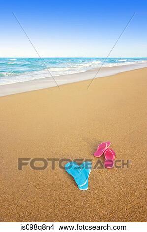 Flip flops discarded on the beach View Large Photo Image Picture - Flip flops discarded on the beach. Fotosearch
