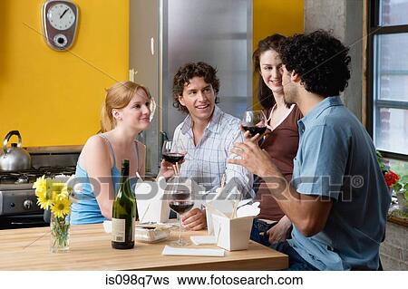 Four friends socializing View Large Photo Image Stock Photograph - Four friends socializing. Fotosearch