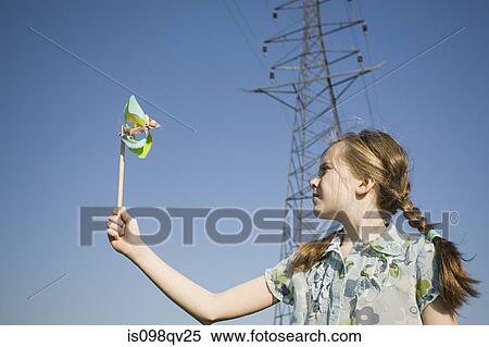 Girl by pylon with pinwheel View Large Photo Image Stock Photography - Girl by pylon with pinwheel. Fotosearch