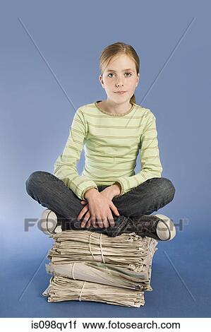 Girl with newspapers View Large Photo Image Stock Image - Girl with newspapers. Fotosearch