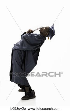 Graduate kissing scroll View Large Photo Image Picture - Graduate kissing scroll. Fotosearch