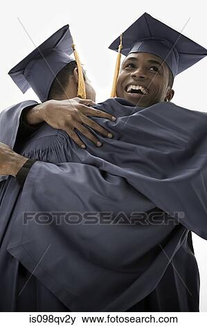 Stock Photo - Graduates hugging. Fotosearch