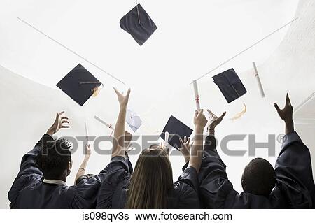 Graduates throwing mortarboards View Large Photo Image Stock Photograph - Graduates throwing mortarboards. Fotosearch