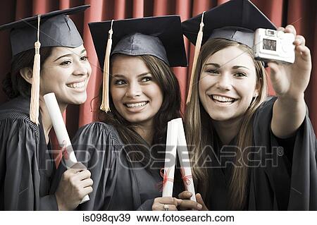 Graduating friends with camera View Large Photo Image Stock Photo - Graduating friends with camera. Fotosearch