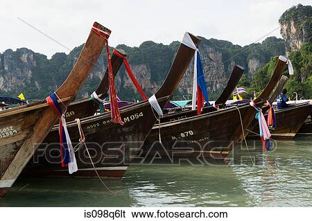 Long tail boats at railay beach View Large Photo Image Stock Photograph - Long tail boats at railay beach. Fotosearch