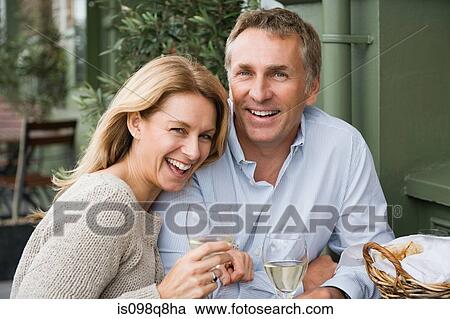 Mature couple drinking wine View Large Photo Image Stock Image - Mature couple drinking wine. Fotosearch