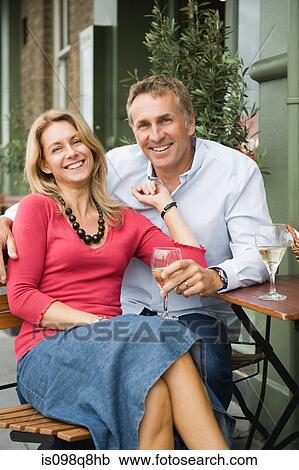 Mature couple drinking wine View Large Photo Image Stock Image - Mature couple drinking wine. Fotosearch