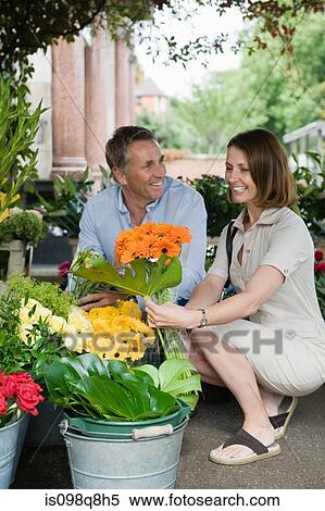 Mature couple shopping for flowers View Large Photo Image Stock Photography - Mature couple shopping for flowers. Fotosearch