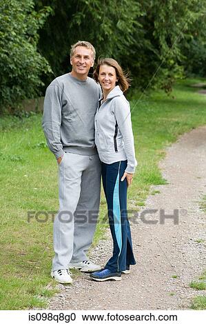 Stock Image - Mature couple wearing tracksuits. Fotosearch