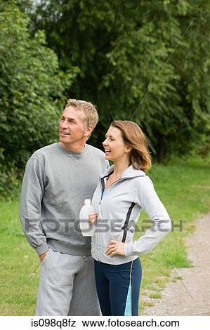 Stock Photo - Mature couple wearing tracksuits. Fotosearch
