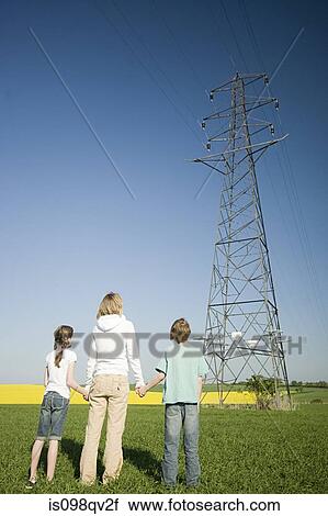 Mother and children by pylon View Large Photo Image Stock Image - Mother and children by pylon. Fotosearch