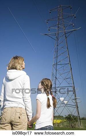Mother and daughter by pylon View Large Photo Image Stock Photo - Mother and daughter by pylon. Fotosearch