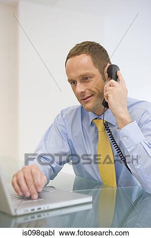 Office worker on telephone View Large Photo Image Stock Image - Office worker on telephone. Fotosearch