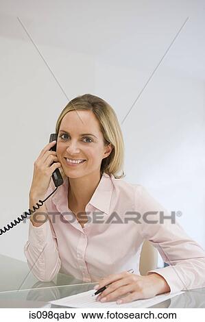 Office worker on telephone View Large Photo Image Stock Photo - Office worker on telephone. Fotosearch