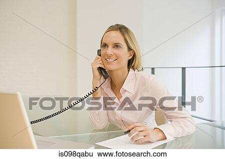 Office worker on telephone View Large Photo Image Stock Photograph - Office worker on telephone. Fotosearch