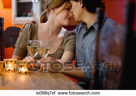 Romantic couple in a bar View Large Photo Image Stock Image - Romantic couple in a bar. Fotosearch