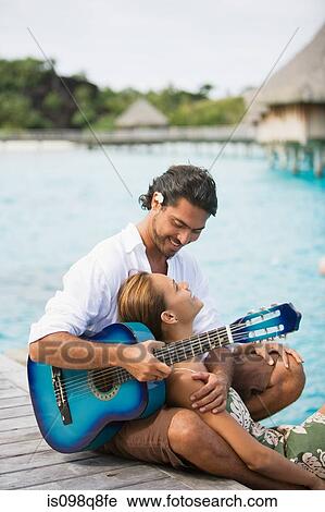 Romantic couple with guitar View Large Photo Image Stock Image - Romantic couple with guitar. Fotosearch