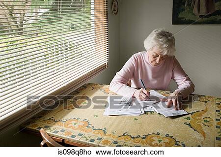 Senior woman writing View Large Photo Image Picture - Senior woman writing. Fotosearch