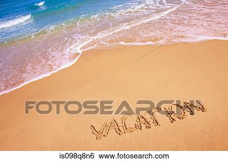 Stock Photograph - Vacation written in the sand. Fotosearch