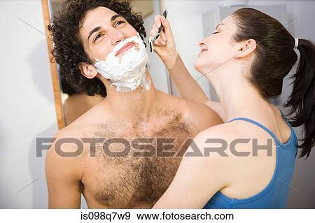 Woman helping a man shave View Large Photo Image Stock Photo - Woman helping a man shave. Fotosearch