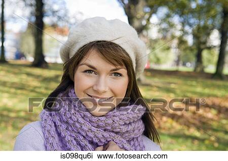 Stock Image - Woman in scarf and hat. Fotosearch