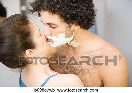 Woman kissing man with shaving foam View Large Photo Image Stock Image - Woman kissing man with shaving foam. Fotosearch