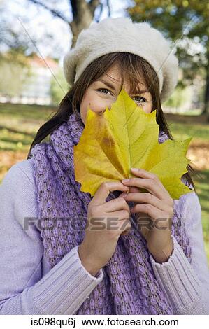 Woman with a leaf View Large Photo Image Stock Image - Woman with a leaf. Fotosearch