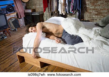 Young man sleeping View Large Photo Image Stock Image - Young man sleeping. Fotosearch