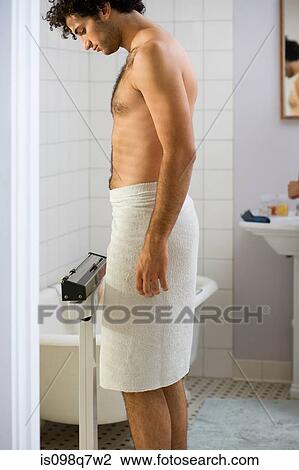 Young man wearing a towel View Large Photo Image Stock Image - Young man wearing a towel. Fotosearch