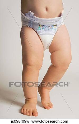 A baby wearing a nappy View Large Photo Image Stock Photo - A baby wearing a nappy. Fotosearch