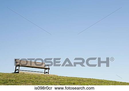 A bench on a hill View Large Photo Image Stock Photography - A bench on a hill. Fotosearch