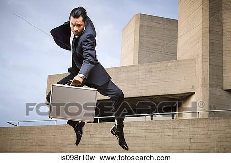 A businessman jumping View Large Photo Image Stock Photo - A businessman jumping. Fotosearch