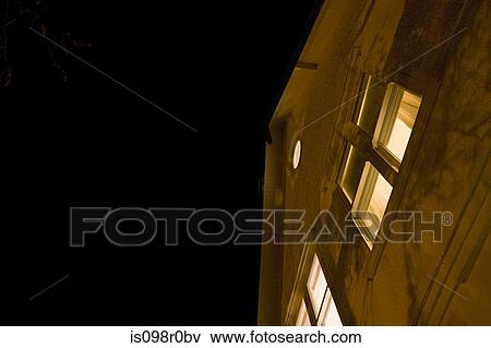 A house exterior at night View Large Photo Image Stock Photo - A house exterior at night. Fotosearch