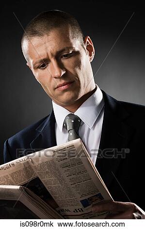 A man reading a newspaper View Large Photo Image Stock Image - A man reading a newspaper. Fotosearch